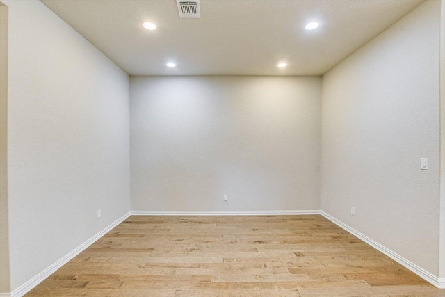 spare room with visible vents, recessed lighting, baseboards, and light wood-style floors