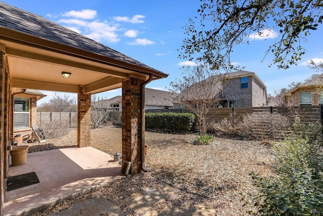 view of yard with a patio and a fenced backyard