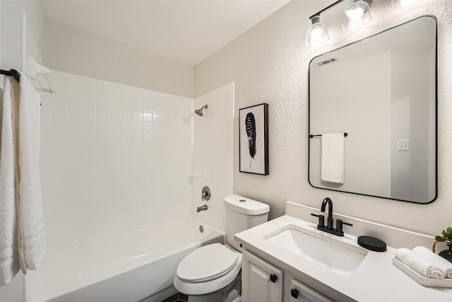 bathroom featuring visible vents, toilet, bathing tub / shower combination, a textured wall, and vanity