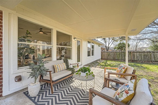 view of patio with outdoor lounge area and fence