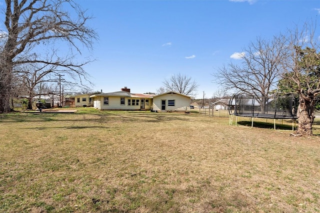 view of yard featuring a trampoline