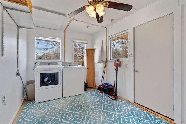 laundry area featuring laundry area, washer and dryer, and ceiling fan