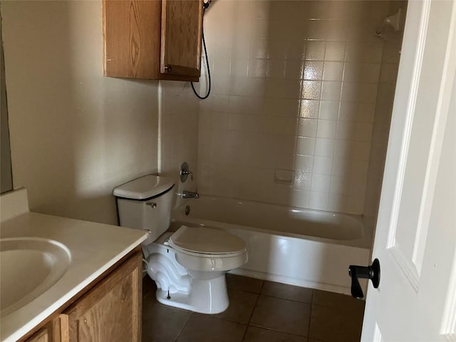 full bath with tile patterned floors, washtub / shower combination, toilet, and vanity