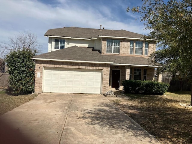 1118 Henderson Dr, Leander, TX 78641 - traditional-style house with driveway, a garage, brick siding, and a shingled roof