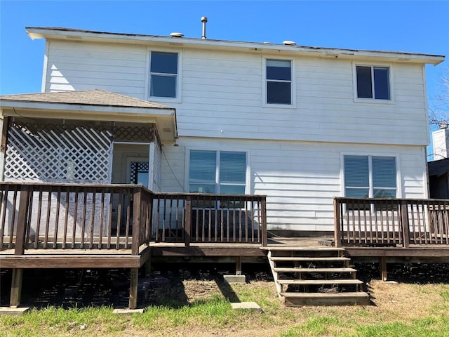 back of property featuring a wooden deck