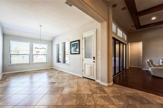 tiled entrance foyer featuring recessed lighting, baseboards, a chandelier, and visible vents