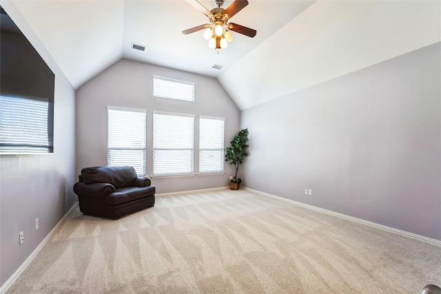 sitting room featuring ceiling fan, visible vents, vaulted ceiling, carpet floors, and baseboards