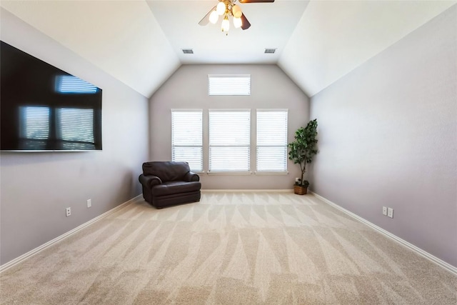 unfurnished room featuring visible vents, a ceiling fan, carpet floors, and vaulted ceiling