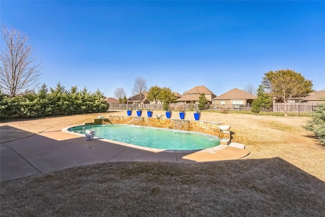 view of swimming pool featuring a yard, a fenced in pool, a fenced backyard, and a patio area