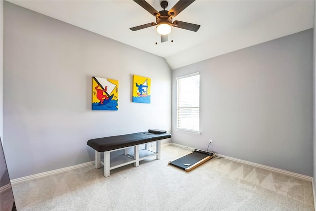 interior space with carpet floors, baseboards, ceiling fan, and lofted ceiling