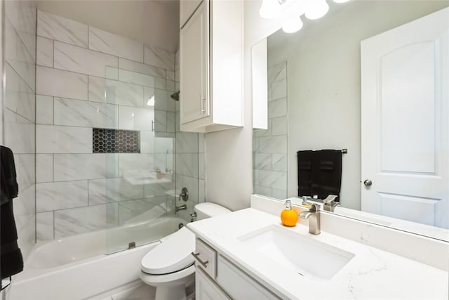 bathroom featuring shower / bathtub combination, vanity, and toilet