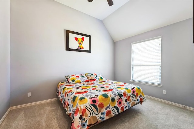 bedroom featuring baseboards, carpet flooring, ceiling fan, and vaulted ceiling