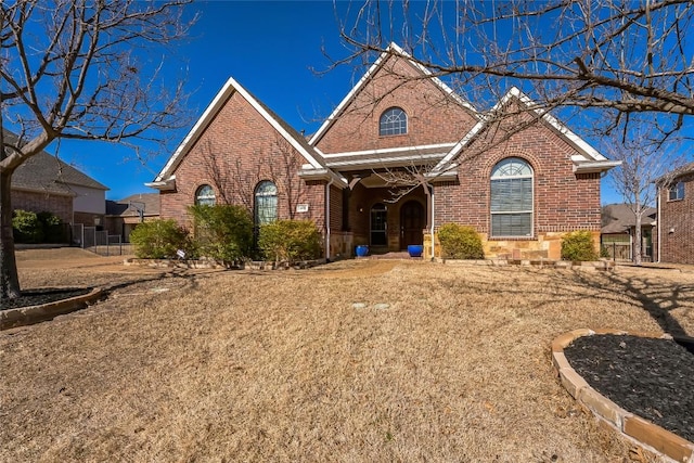 view of front of home featuring brick siding