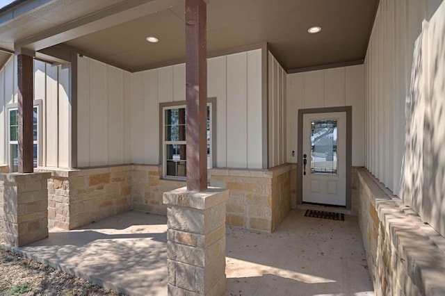 entrance to property featuring stone siding