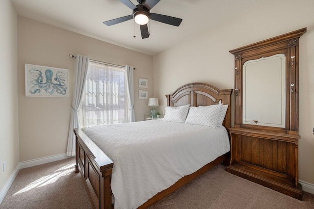 carpeted bedroom with baseboards and a ceiling fan