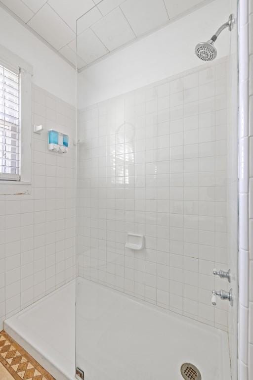 bathroom with a tile shower