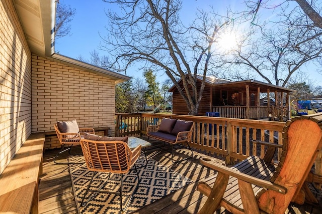 wooden deck featuring an outdoor hangout area