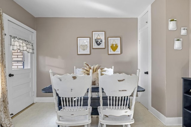 dining room featuring baseboards