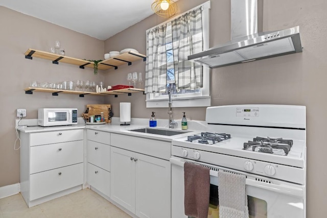 kitchen featuring a sink, white appliances, wall chimney exhaust hood, white cabinets, and light countertops