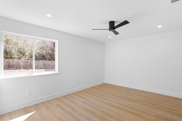 unfurnished room with light wood finished floors, visible vents, baseboards, recessed lighting, and a ceiling fan