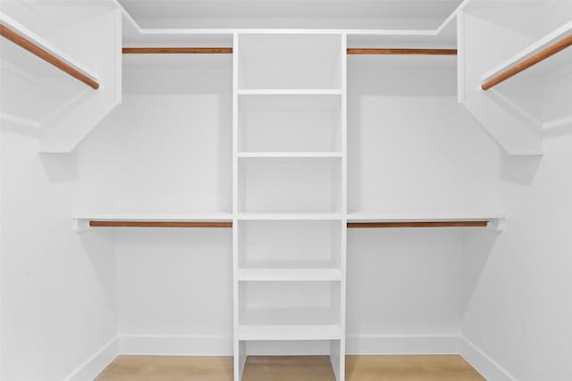 spacious closet with wood finished floors