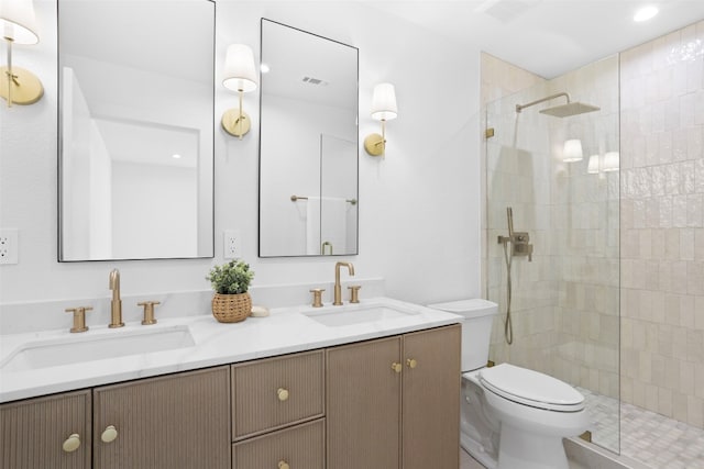 bathroom with visible vents, a walk in shower, toilet, and a sink