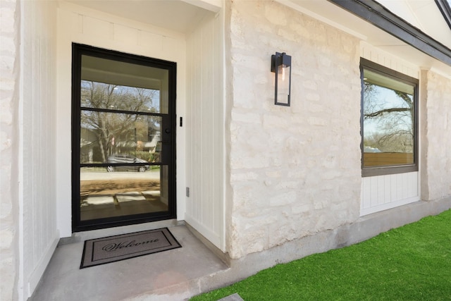 view of exterior entry with stone siding