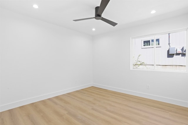 empty room with recessed lighting, baseboards, light wood-style flooring, and a ceiling fan