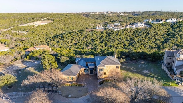 aerial view featuring a wooded view