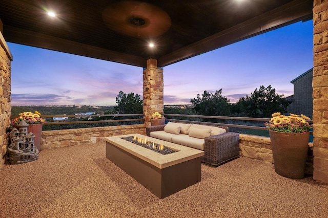 patio terrace at dusk with a fire pit