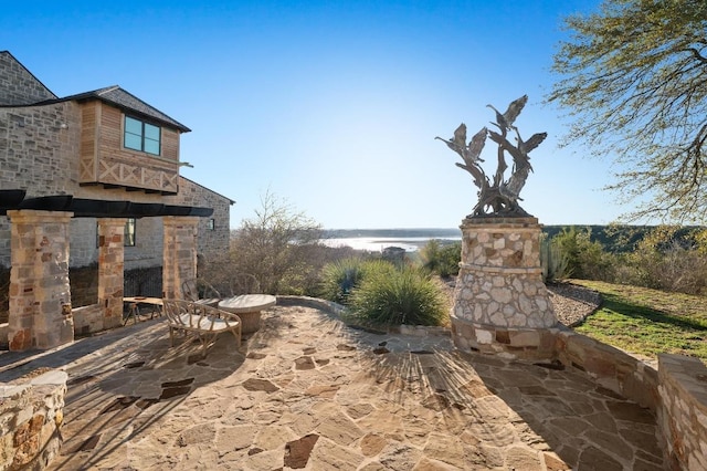 view of patio / terrace with a water view