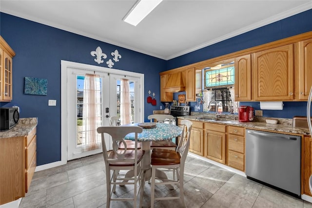 kitchen with crown molding, glass insert cabinets, appliances with stainless steel finishes, french doors, and a sink