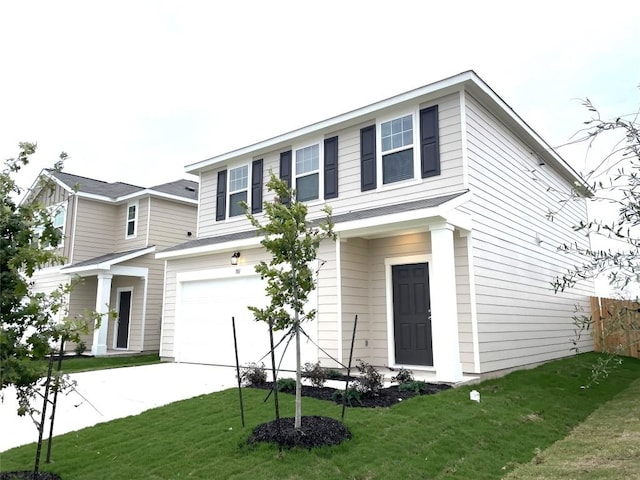 traditional-style home with an attached garage, concrete driveway, and a front lawn