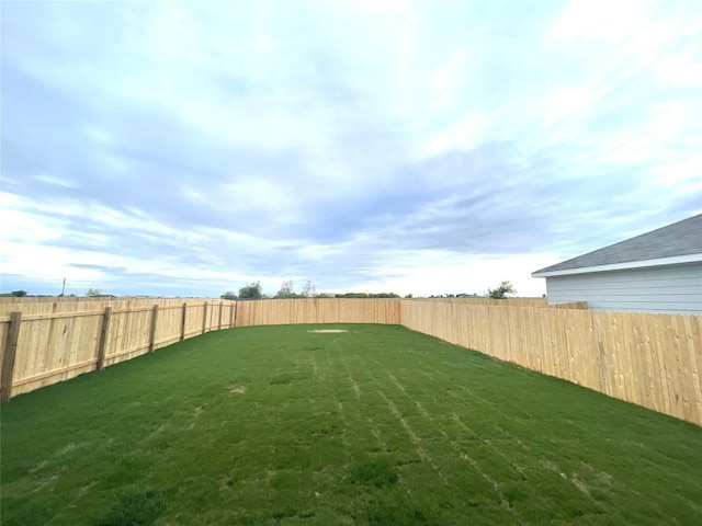 view of yard featuring a fenced backyard