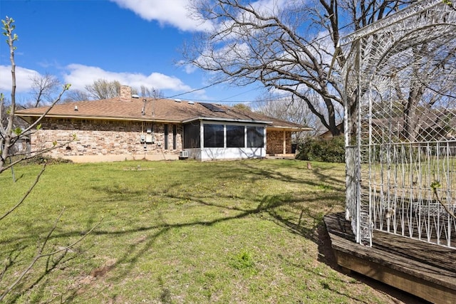 view of yard with a sunroom