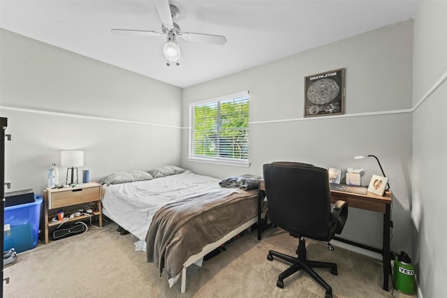 bedroom with a ceiling fan and carpet