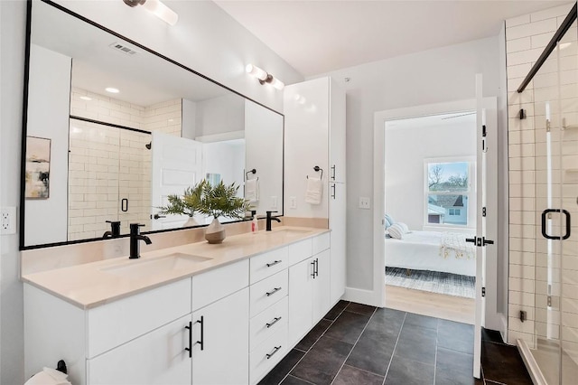 full bathroom with a sink, double vanity, ensuite bath, and a shower stall