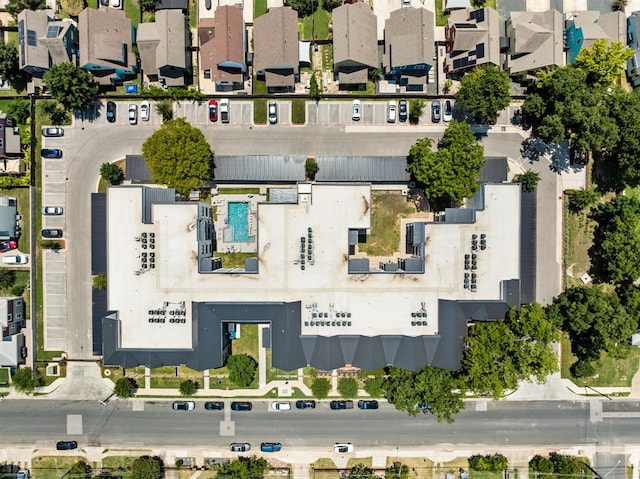 birds eye view of property with a residential view