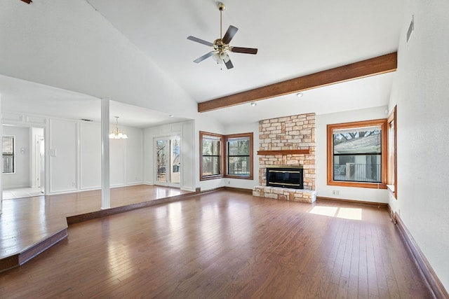 unfurnished living room with beam ceiling, ceiling fan with notable chandelier, a fireplace, and hardwood / wood-style flooring