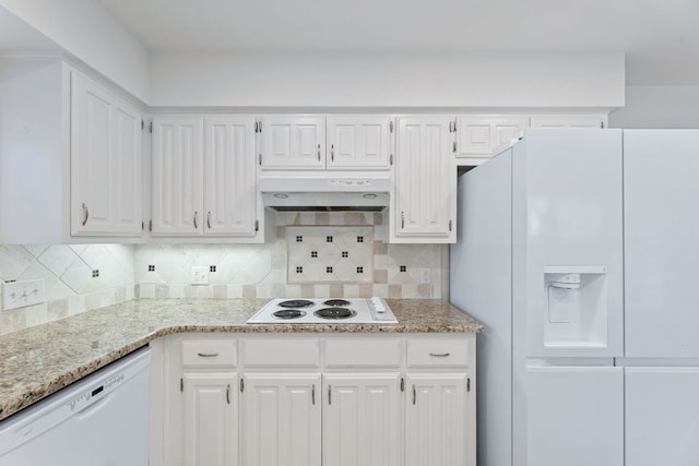 kitchen featuring under cabinet range hood, white appliances, tasteful backsplash, and white cabinetry