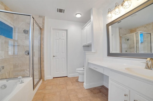 bathroom featuring visible vents, a stall shower, and vanity