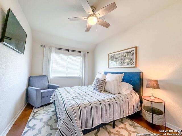 320 Mill Run, New Braunfels, TX 78132 - bedroom with baseboards, vaulted ceiling, and a ceiling fan