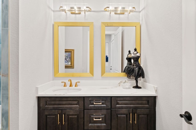 full bathroom featuring a sink and double vanity