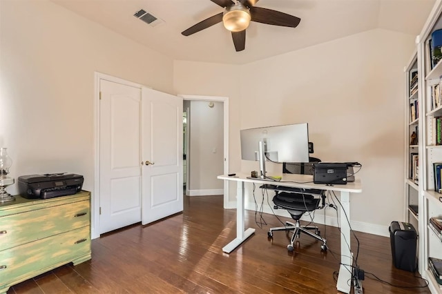 office area with wood finished floors, baseboards, a ceiling fan, visible vents, and vaulted ceiling