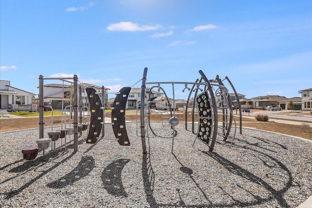 community jungle gym featuring a residential view