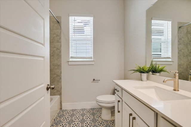 full bath with tile patterned flooring, baseboards, washtub / shower combination, toilet, and vanity