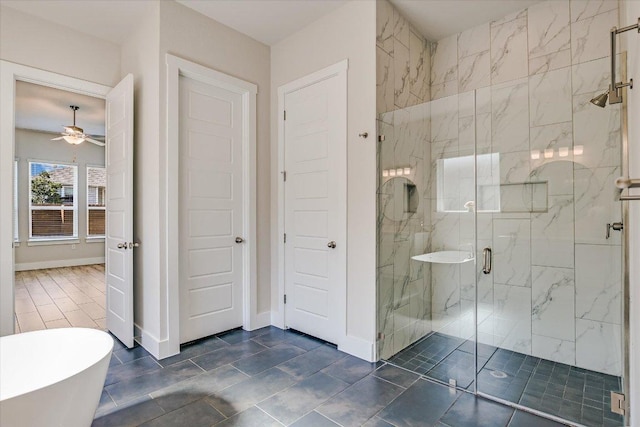 full bath featuring a soaking tub, baseboards, a marble finish shower, and ceiling fan