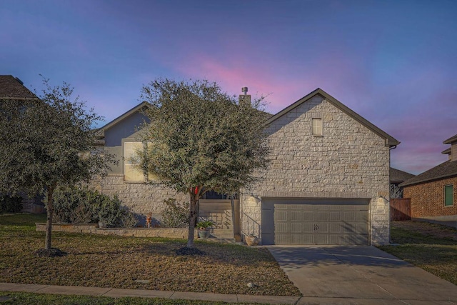 obstructed view of property featuring concrete driveway, an attached garage, stone siding, and a chimney