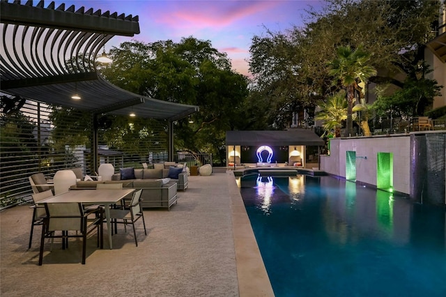 outdoor pool featuring an outbuilding and a patio area