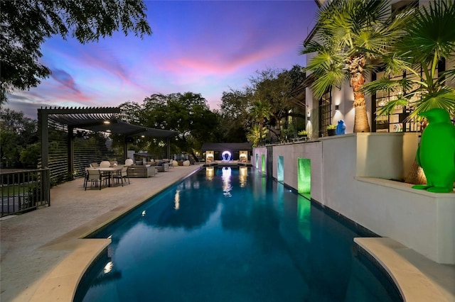 pool at dusk with an outdoor pool, a patio area, fence, and a pergola